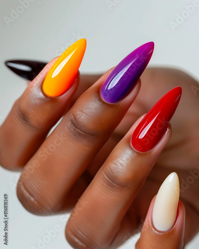 AI generated photo of a black woman s hand with bright multicolored manicure on long stiletto nails. Isolated on white background