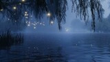 Willow tree branches with glowing lights overhanging a calm lake at dusk.