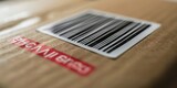A close-up image of a shipping label with a barcode on a cardboard box.