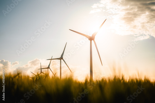 Wind turbines farm, wind power energy generation equipment, clean energy concept. Windmills in the sunlight. Renewable and green energy © Benoît