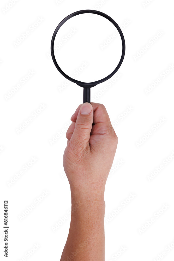 A hand holding a magnifying glass isolated and cutout from background. A hand holding a magnifying glass isolated and cutout from background.