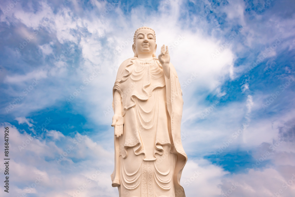 Giant Buddha statue in Vietnam with blue sky