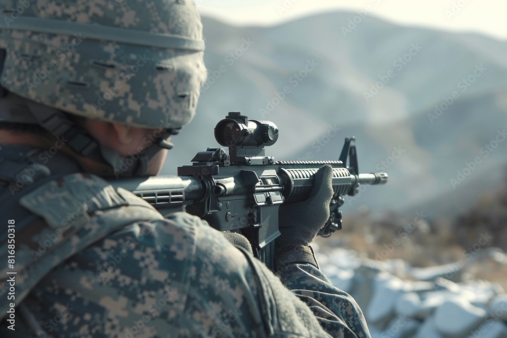Fototapeta premium A soldier stands in front of towering mountains, holding a rifle in a vigilant stance