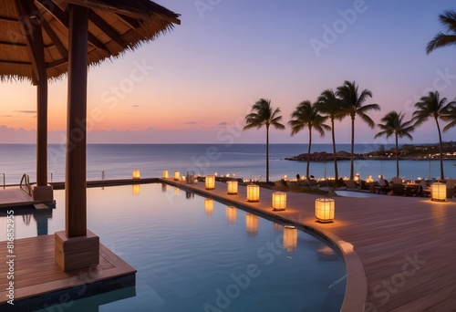 A luxury resort pool overlooking the ocean at sunset  with floating lanterns and umbrellas  a wooden deck and palm trees in the background 