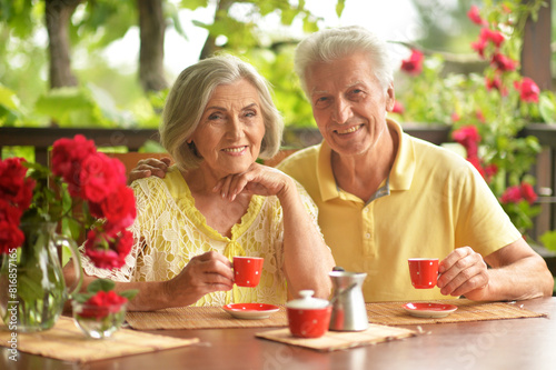 Portrait of senior couple drinking coffee at home