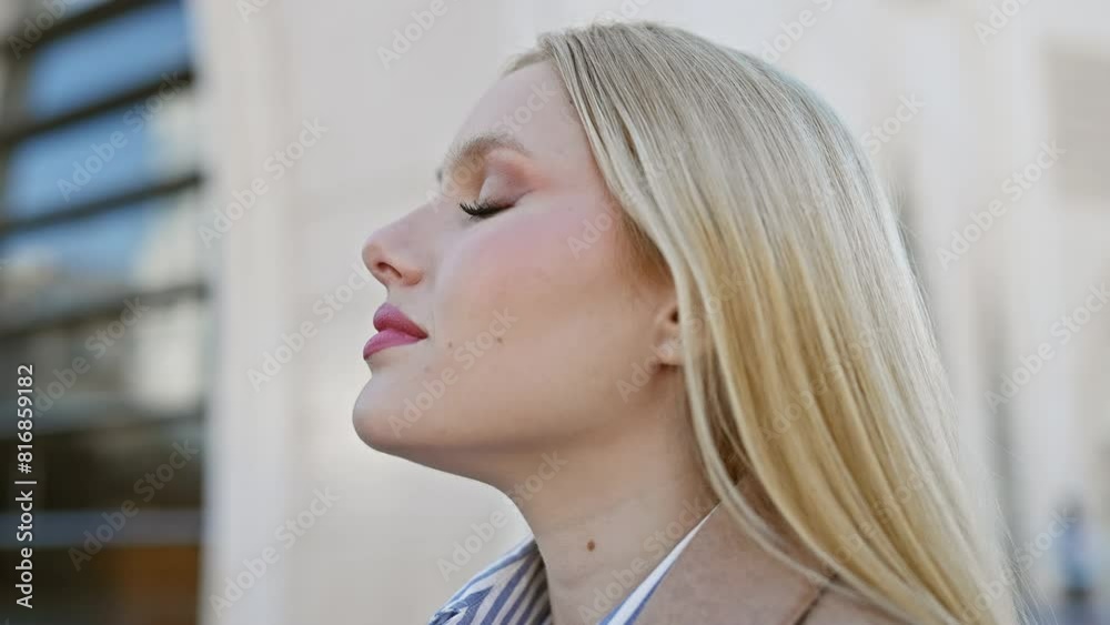A contemplative young woman with blonde hair on a city street, exuding calmness and beauty in an urban setting. A contemplative young woman with blonde hair on a city street, exuding calmness and beauty in an urban setting.