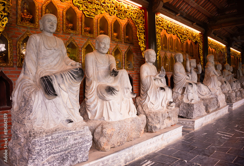 Many Buddha statues in a hindu temple in Vietnam