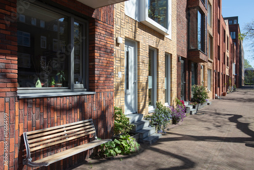 Street with apartments and a bench in the Netherlands photo