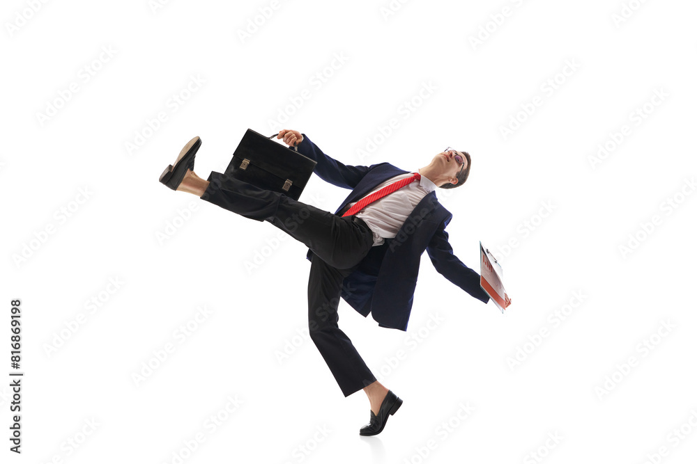 Fototapeta premium Motivated businessman, worker in formal wear with briefcase and documents walking to work isolated on white background. Concept of business, office lifestyle, employment. Dynamic pose