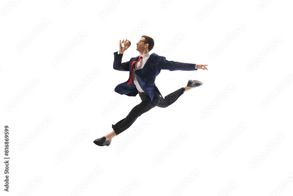 Energetic businessman in mid-leap pose jumping to work, drinking coffee on his way isolated on white background. Employee showing excitement. Concept of business, office lifestyle, motivation