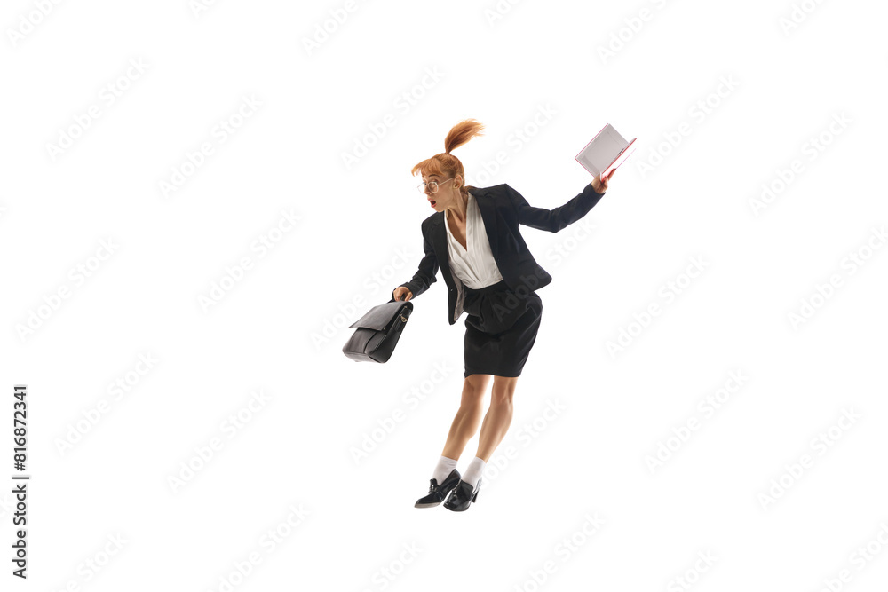 Deadlines and burning projects. Emotional woman in business suit jumping with briefcase and notebook isolated on white background. Concept of business, office lifestyle, ambitions, management