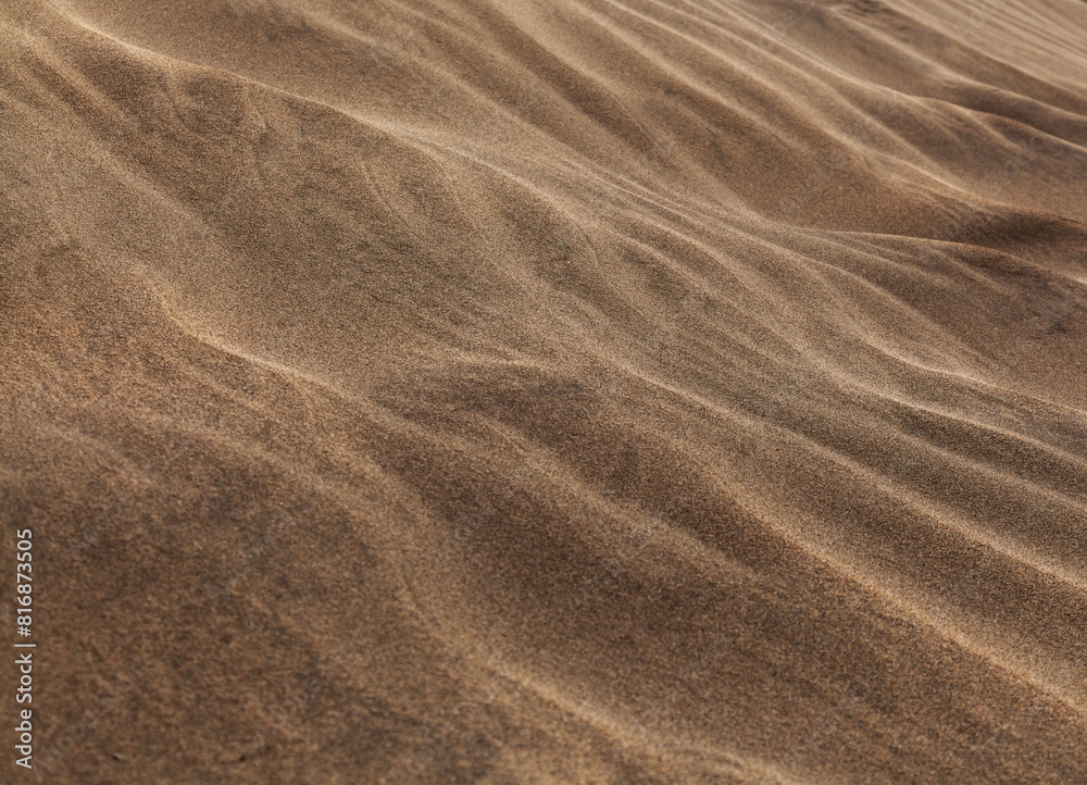 natural sand pattern created by wind blowing differently sized and colored particles natural sand pattern created by wind blowing differently sized and colored particles