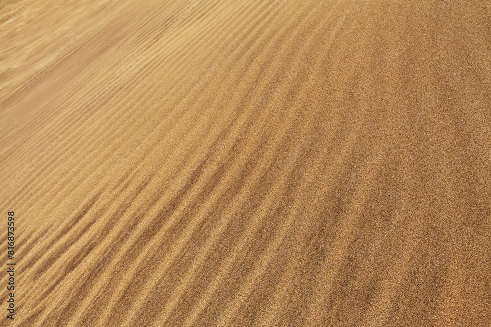 natural sand pattern created by wind blowing differently sized and colored particles natural sand pattern created by wind blowing differently sized and colored particles