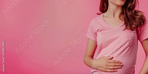 Wallpaper Mural A pregnant woman tenderly hugs her belly on a pink background. The concept of preparing women for pregnancy, childbirth, motherhood. Torontodigital.ca