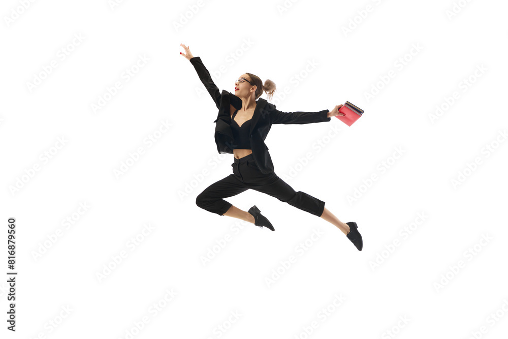 Dynamic image of motivated and enthusiastic woman in formal wear, in mid-air pose reaching professional success and growth isolated on white background. Concept of business, office lifestyle