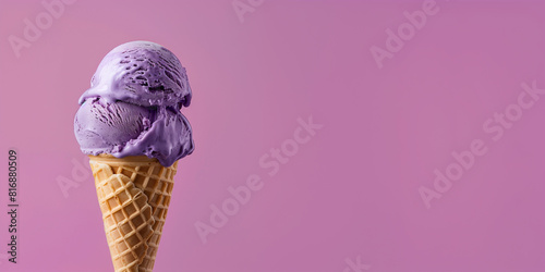 purple ice cream with waffle cone isolated on a purple background, copy space