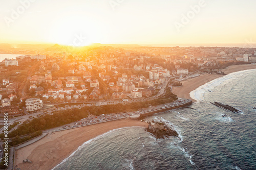 Sandy beach on the coast of Spanish city of Santander at sunset photo