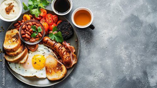 Wallpaper Mural A traditional full English breakfast featuring a fried egg, sausages, toast, baked beans, bacon, black pudding, fresh tomatoes, and parsley, accompanied by coffee and tea. Torontodigital.ca