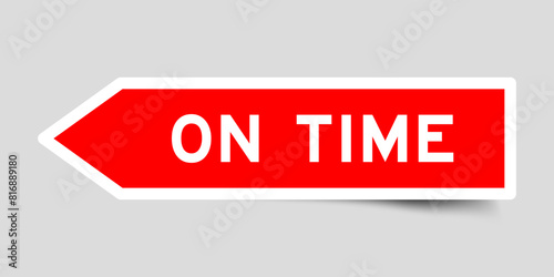 Red color arrow shape sticker label with word on time on gray background