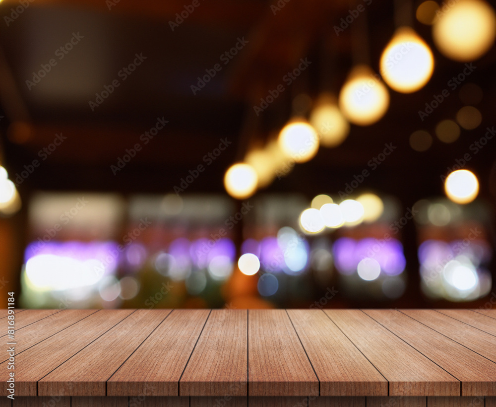 Empty wooden table top with lights bokeh on blur restaurant background. Empty wooden table top with lights bokeh on blur restaurant background.