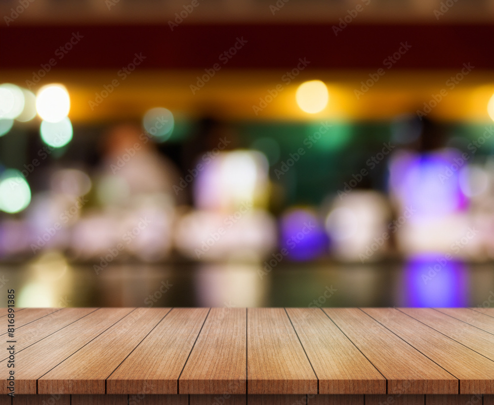 Empty wooden table top with lights bokeh on blur restaurant background. Empty wooden table top with lights bokeh on blur restaurant background.