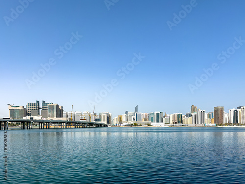Abu Dhabi, UAE skyline as seen from Al Maryah Island, formerly known as Sowwah Island, a natural island located northeast of Abu Dhabi city center photo