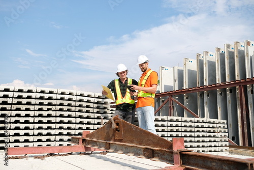 Engineer wearing safety helmet working at construction site.