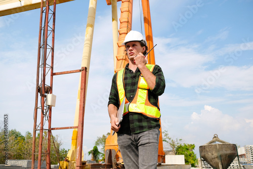 Engineer wearing safety helmet working at job site. Engineer concept.