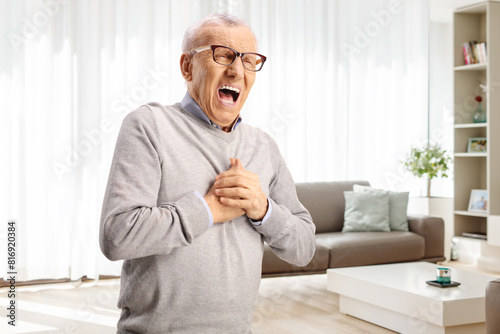 Canvas Print Elderly man suffering cardiac arrest