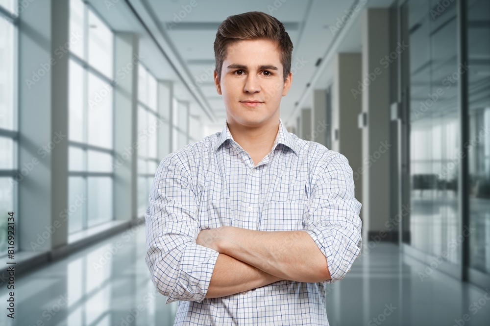 Ambitious handsome male employee posing in office Ambitious handsome male employee posing in office