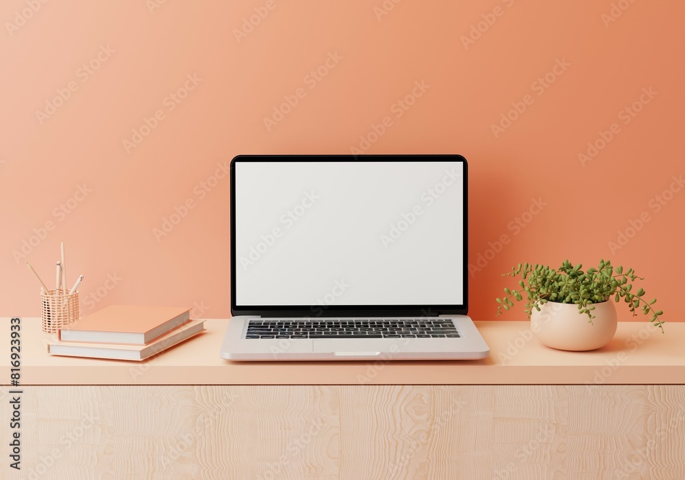 Fototapeta premium Warm Peach Fuzz Workspace with mockup blank screen laptop computer. 3D render.