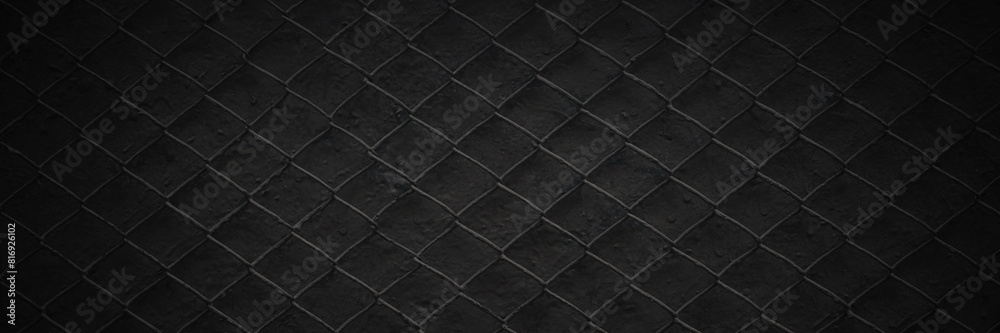 Metal mesh texture. Pattern of metal grid on a gray background. Dark wide panoramic background for design.
