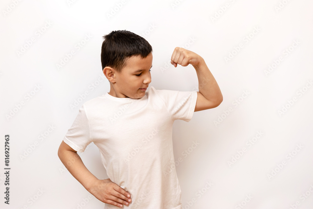 The guy strained his muscles, showing off his biceps. Healthy lifestyle and sports. The guy strained his muscles, showing off his biceps. Healthy lifestyle and sports.