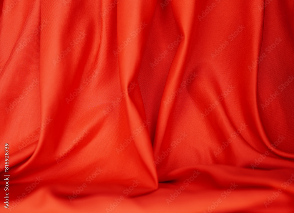 Red satin or silk is beautiful and luxurious. Background (blurred) Red satin or silk is beautiful and luxurious. Background (blurred)