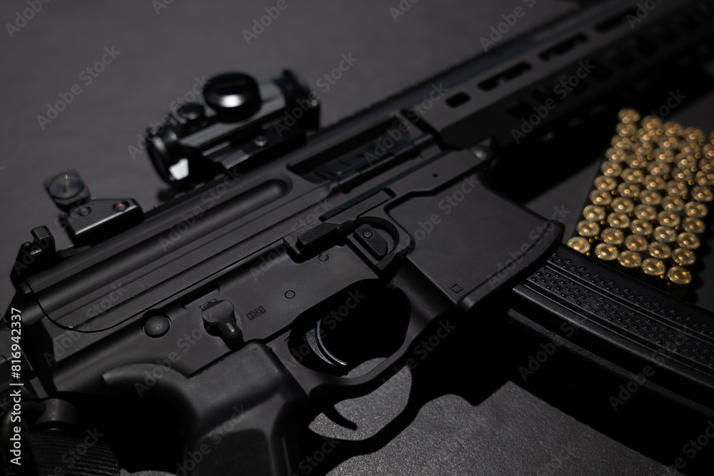 Modern Elegant Assault Rifle and Bullet on Grey Background in Switzerland. Modern Elegant Assault Rifle and Bullet on Grey Background in Switzerland.
