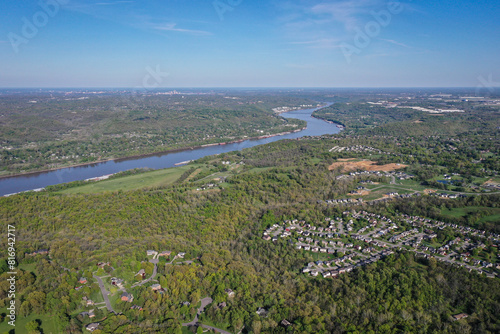 Ohio River near Cincinnati between Ohio and Northern Kentucky with suburbs and rural farm areas.