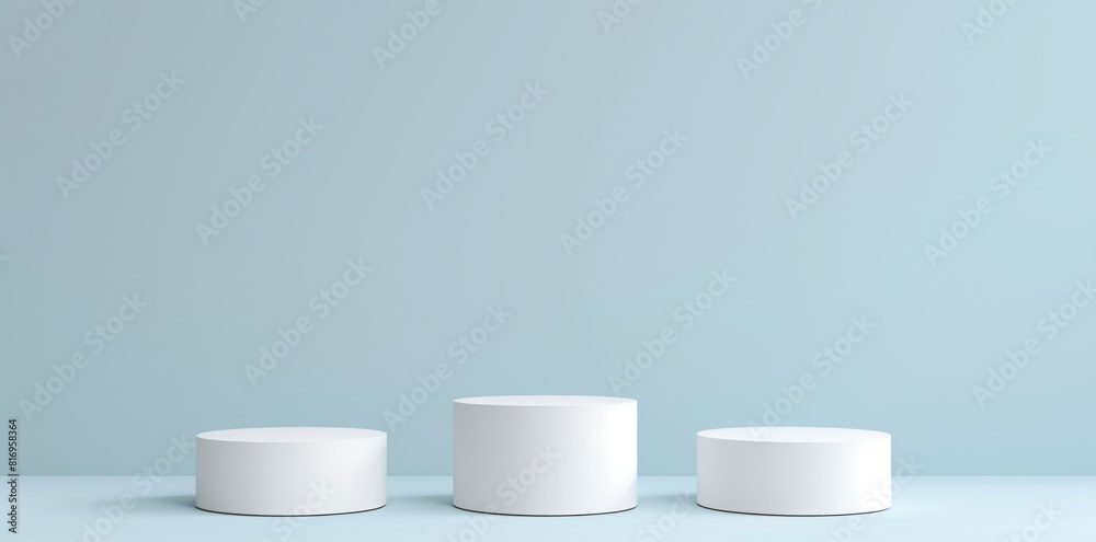 Abstract white background with three cylinder pedestal podiums for product presentation Abstract white background with three cylinder pedestal podiums for product presentation