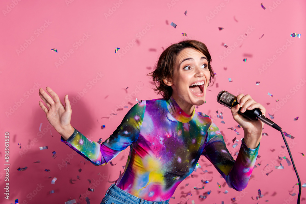 Photo of nice young woman sing mic wear pullover isolated on pink color background