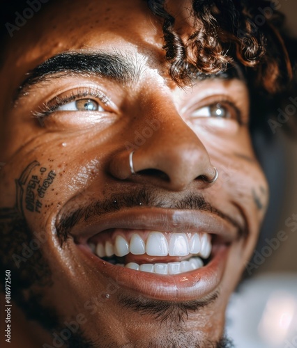 Young man with tattooed fac...