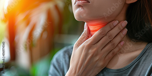 Person is experiencing a sore throat, depicting the discomfort and irritation of a throat ailment, medical attention for soothing relief and recovery photo
