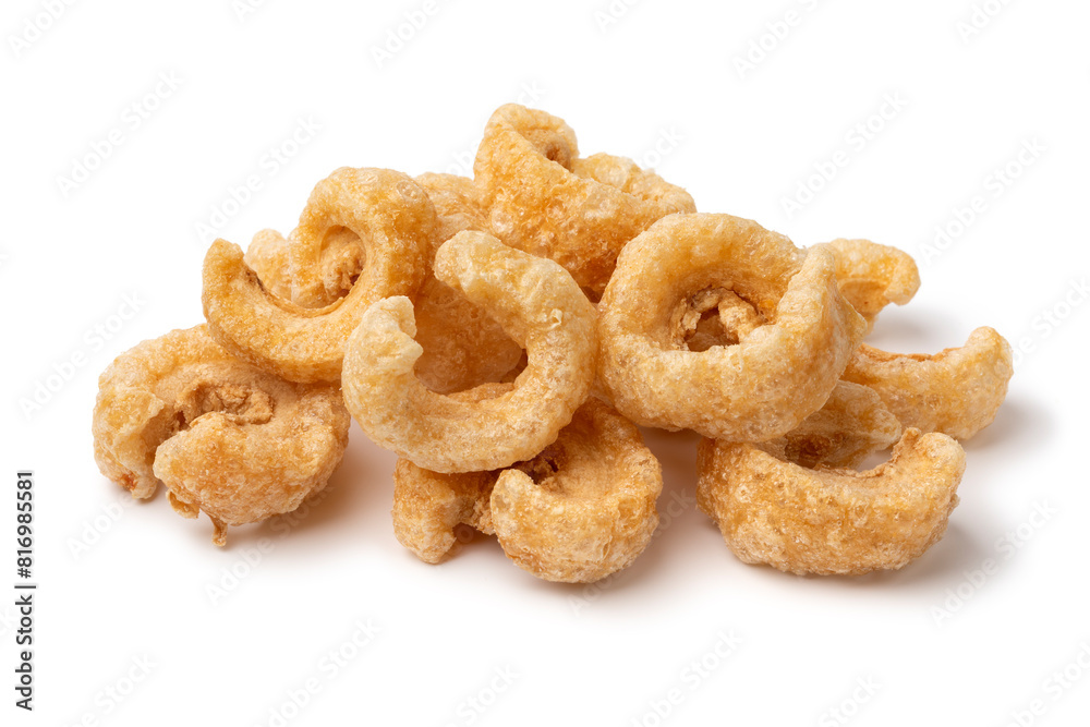 Heap of traditional fried pork rind isolated on white background close up Heap of traditional fried pork rind isolated on white background close up