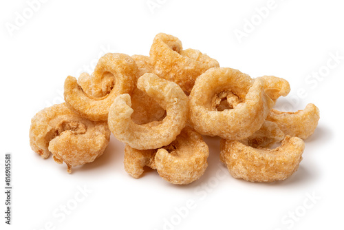 Heap of traditional fried pork rind isolated on white background close up