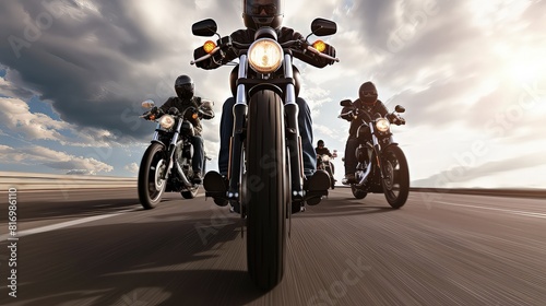 Group of bikers man riding speed motorcycle on empty motion road. A pack of daredevils conquering the road with speed.