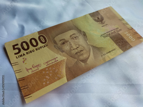 New issuance of Indonesian Rupiah Banknotes in 2022. Rupiah banknotes with a nominal value of five thousand with white background. 