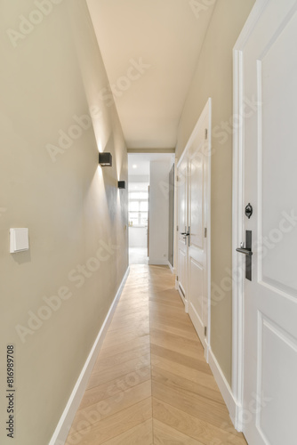 Bright corridor with clean design and wooden flooring photo