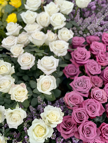 A bouquet of white roses and purple flowers. The arrangement is elegant and sophisticated  with the white roses providing a sense of purity and innocence. Generative AI