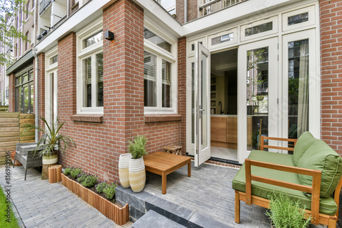 Cozy urban patio with lush greenery and modern furniture photo
