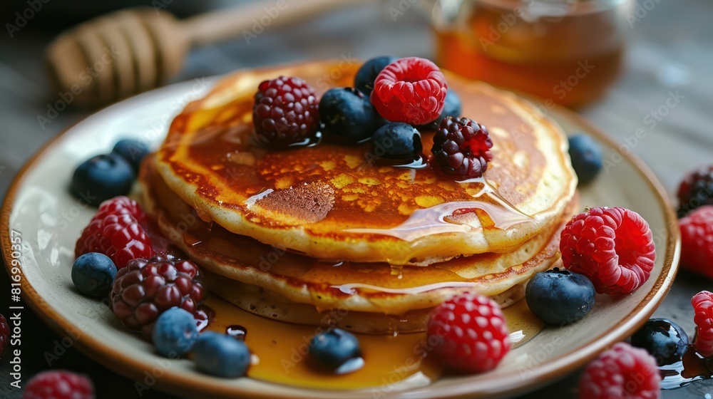 Breakfast with pancakes, berries and syrup. Breakfast with pancakes, berries and syrup.