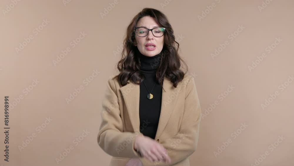 Mature clever businesswoman with gesture - you, think about it. Looking camera.