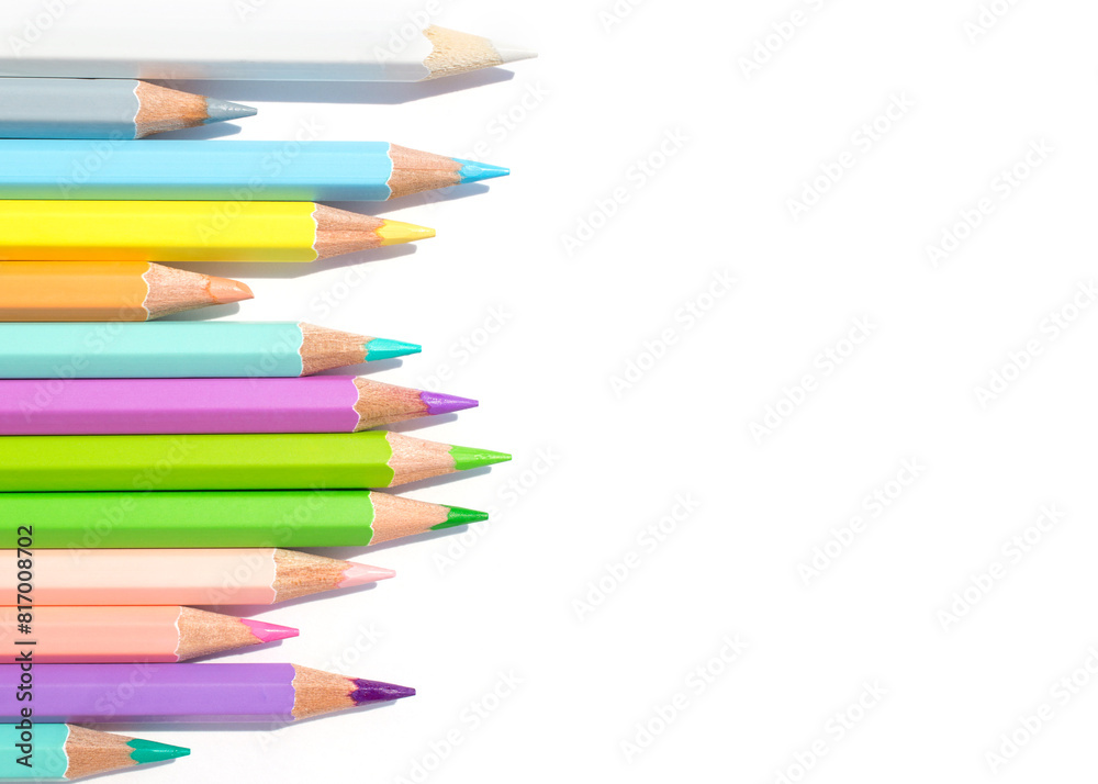 Pastel colored pencils in uneven row on a white background Pastel colored pencils in uneven row on a white background